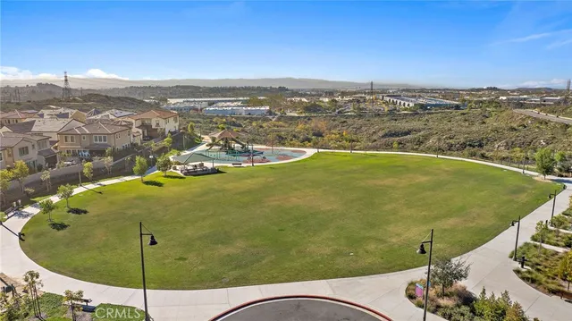 an aerial view of residential houses with outdoor space