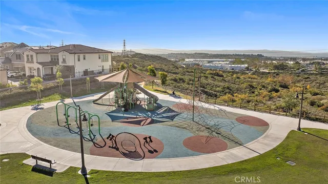 a view of a patio with a table and chairs