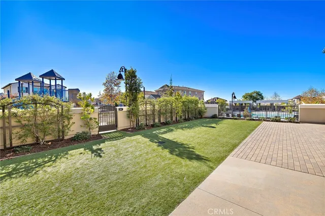 a living room with furniture a rug and a floor to ceiling window