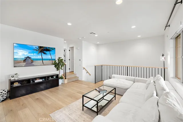 a kitchen with kitchen island a white counter space a sink appliances and cabinets
