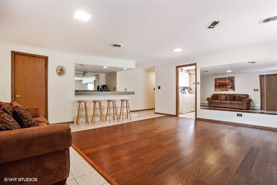 847 Heritage Drive, Unit 1 Addison, IL 60101 - Photo 9 of 10 a living room with furniture and a wooden floor