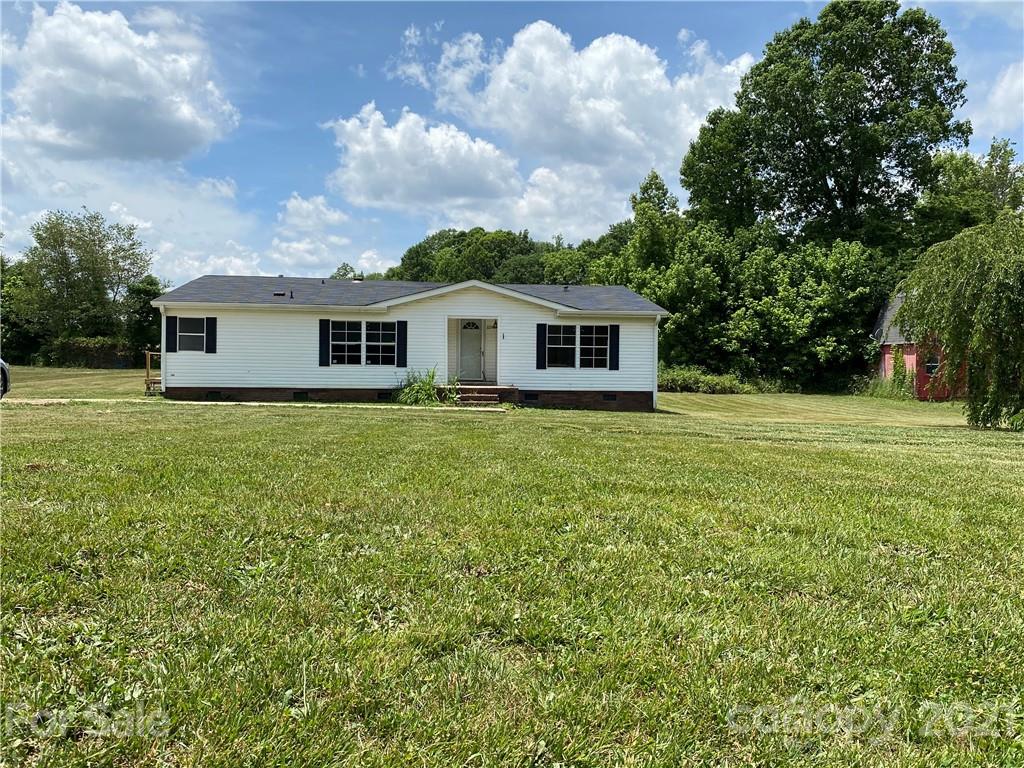 2230 Chenault Road Cleveland, NC 27013 - Photo 1 of 3 a view of a house with a backyard