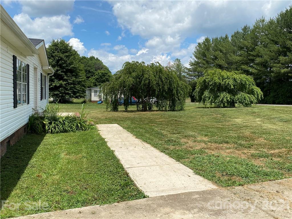 2230 Chenault Road Cleveland, NC 27013 - Photo 2 of 3 a view of a backyard with green space