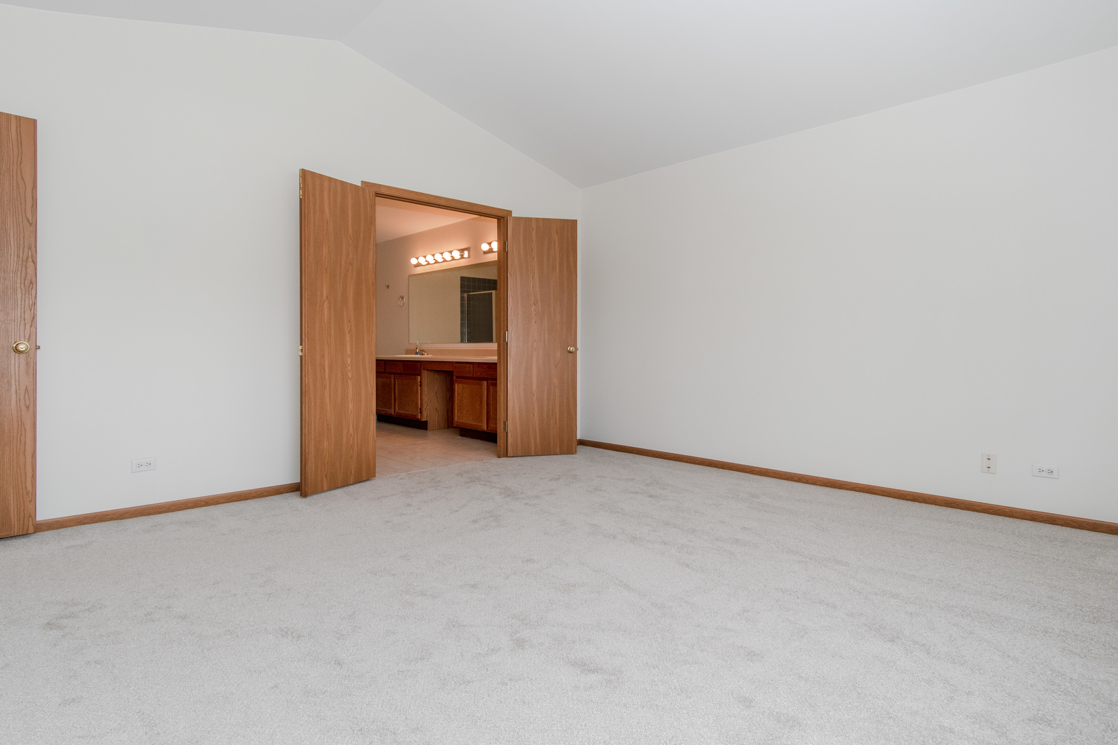 329 Sheffield Court, Unit 2 Roselle, IL 60172 - Photo 12 of 28 a view of an empty room with a window