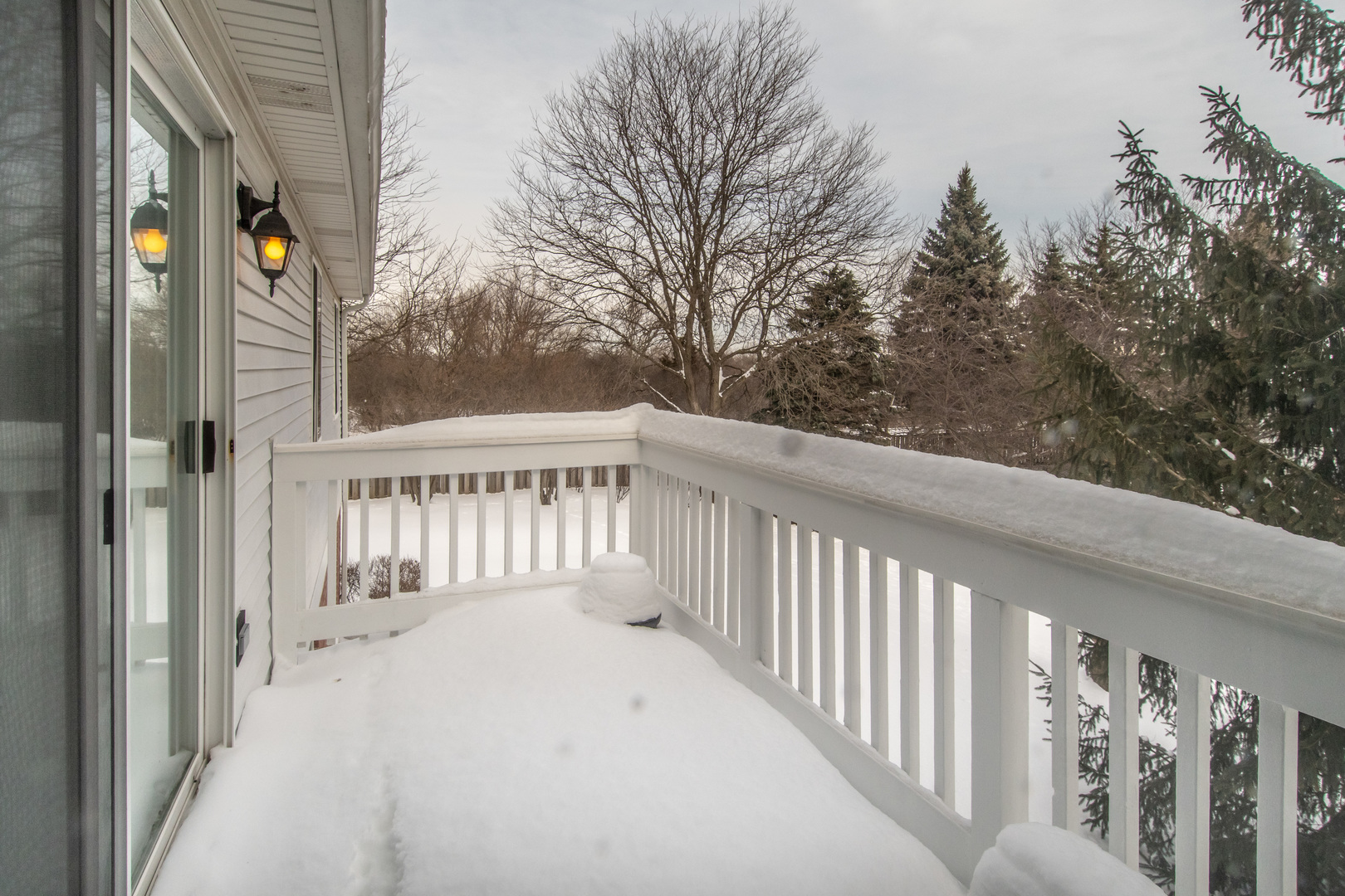 329 Sheffield Court, Unit 2 Roselle, IL 60172 - Photo 27 of 28 a view of a wooden fence from a balcony