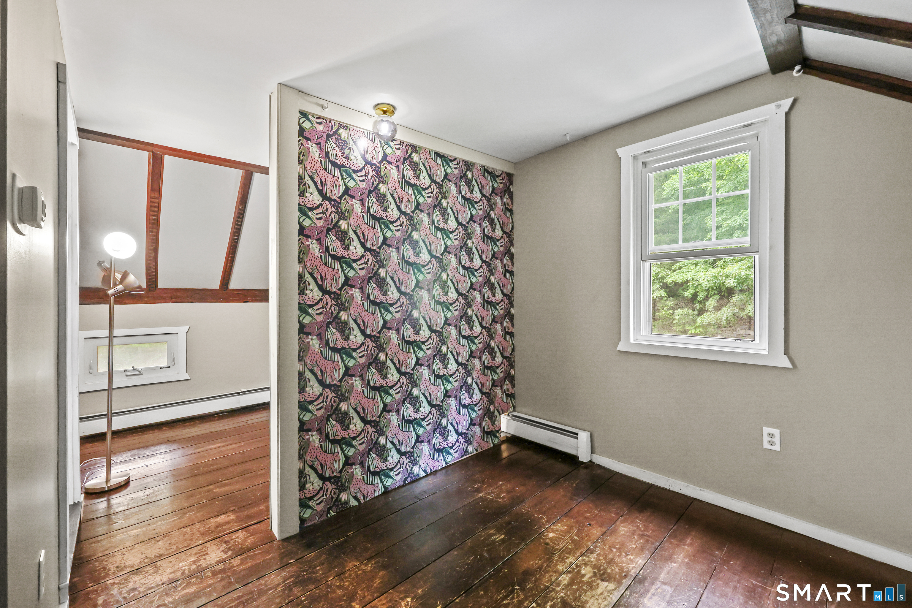 917 Hopewell Road Glastonbury, CT 06033 - Photo 25 of 39 a view of an empty room with window and wooden floor
