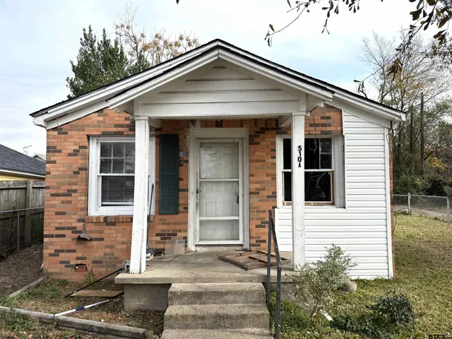 a front view of a house with glass windows