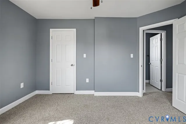 an empty room with closet area