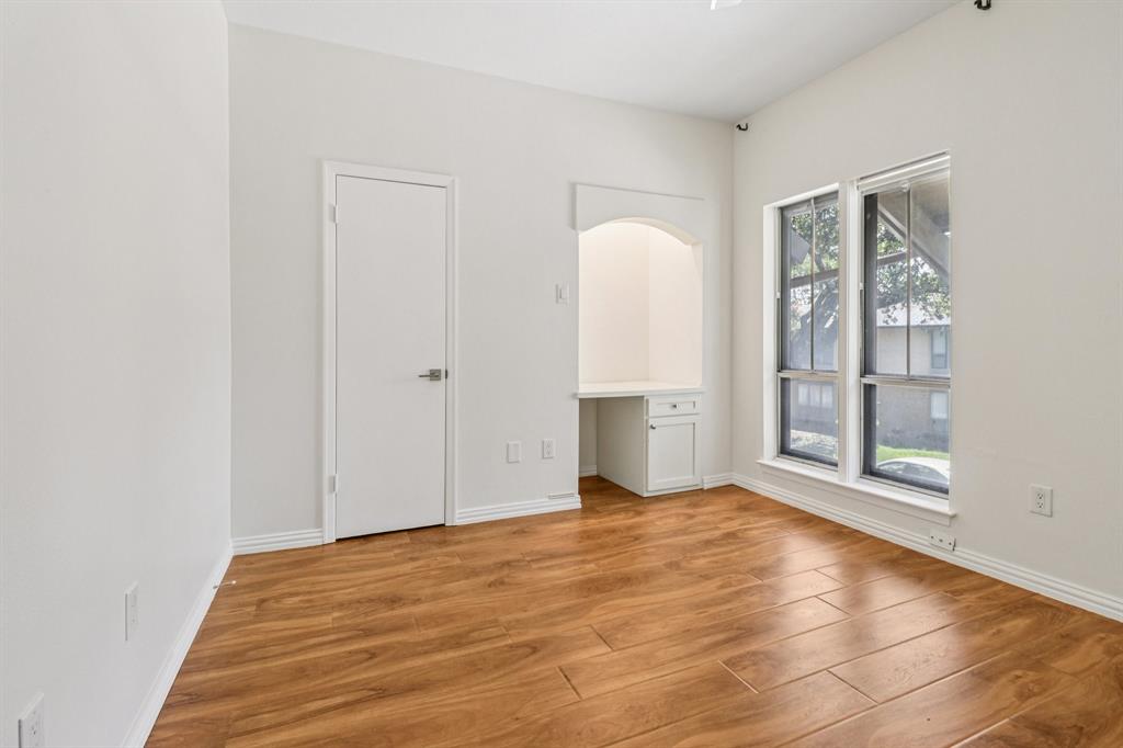 10754 Villager Road, Unit D Dallas, TX 75230 - Photo 19 of 37 a view of an empty room with glass door