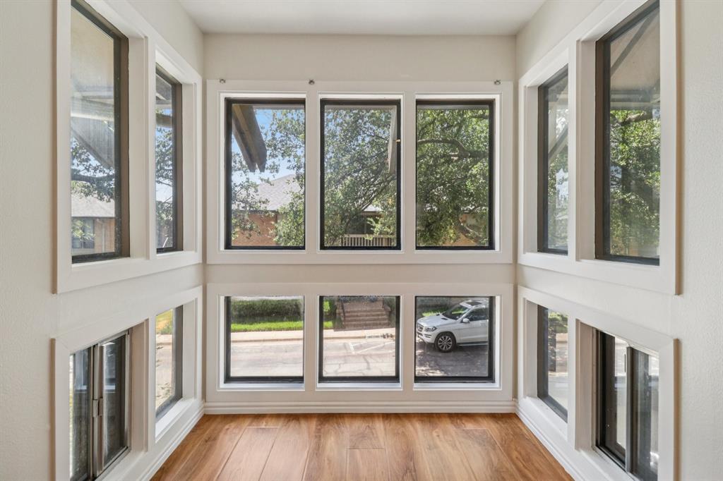 10754 Villager Road, Unit D Dallas, TX 75230 - Photo 8 of 37 a view of wooden door and outdoor space