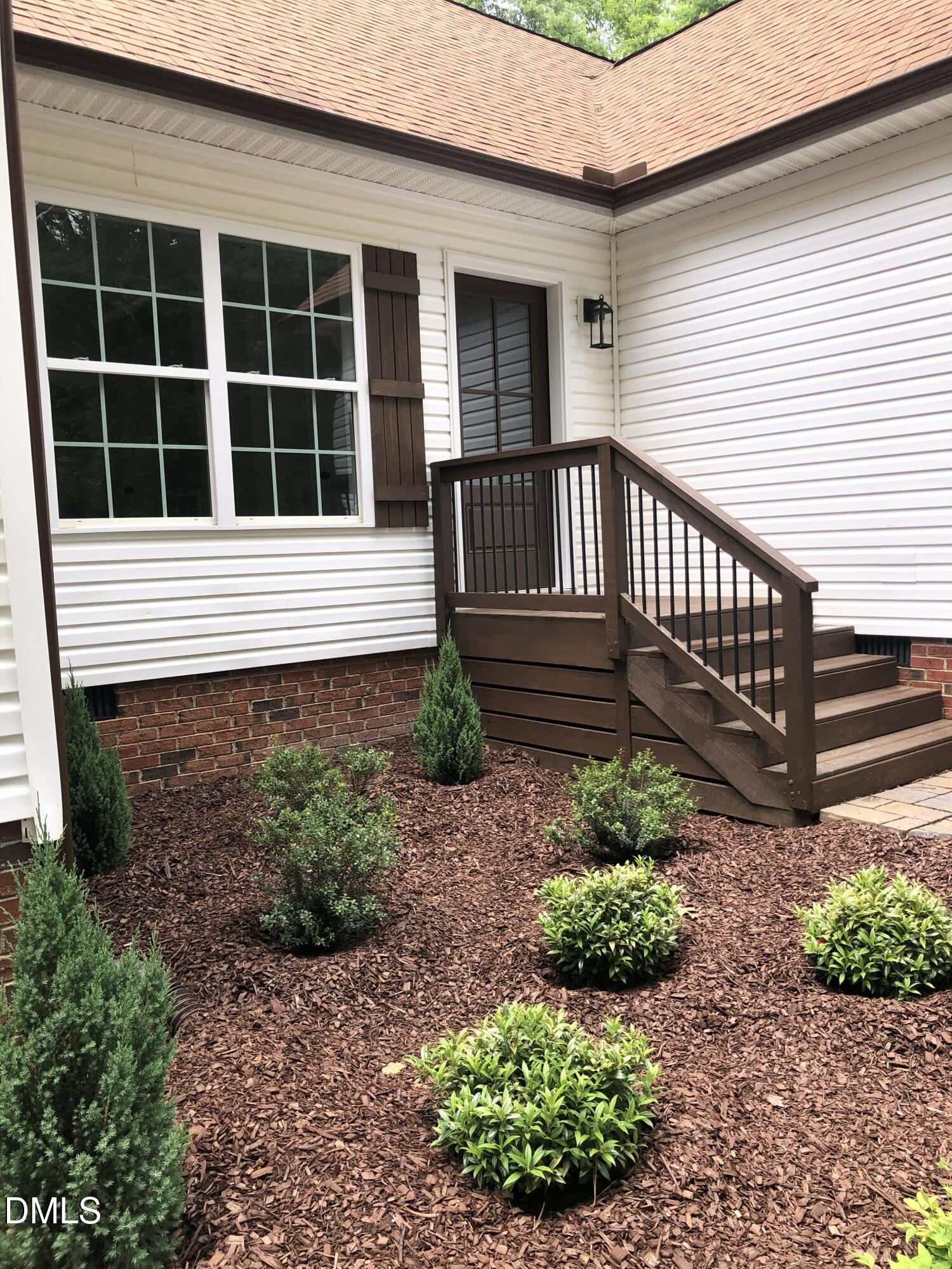 95 Smith Taylor Trail Roxboro, NC 27574 - Photo 11 of 47 a house view with a garden