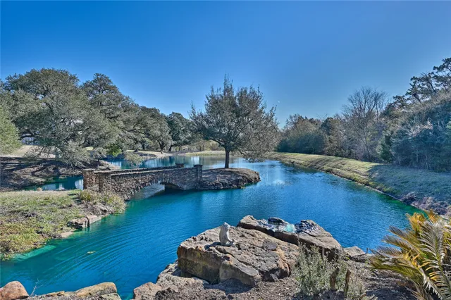 a view of a lake with a big yard