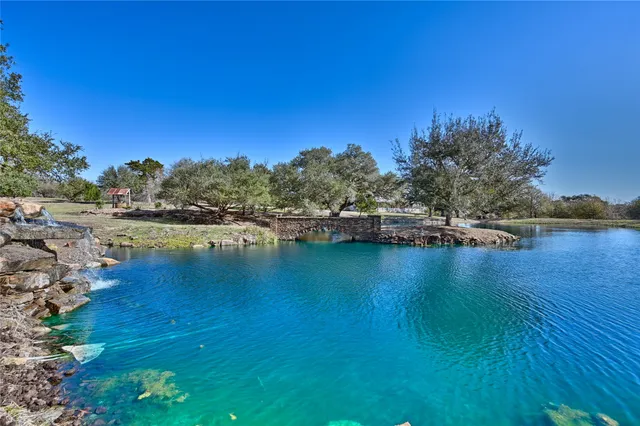 a view of a lake with houses in the background