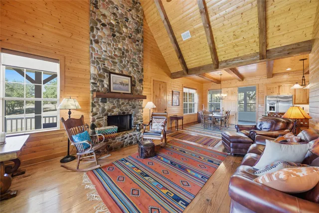 a kitchen with granite countertop a sink appliances and cabinets