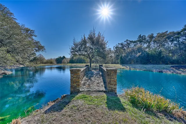 a view of lake with green space