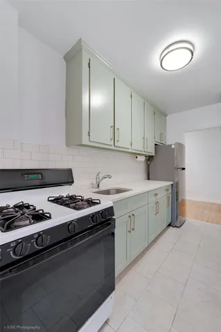 a kitchen with granite countertop cabinets and stainless steel appliances