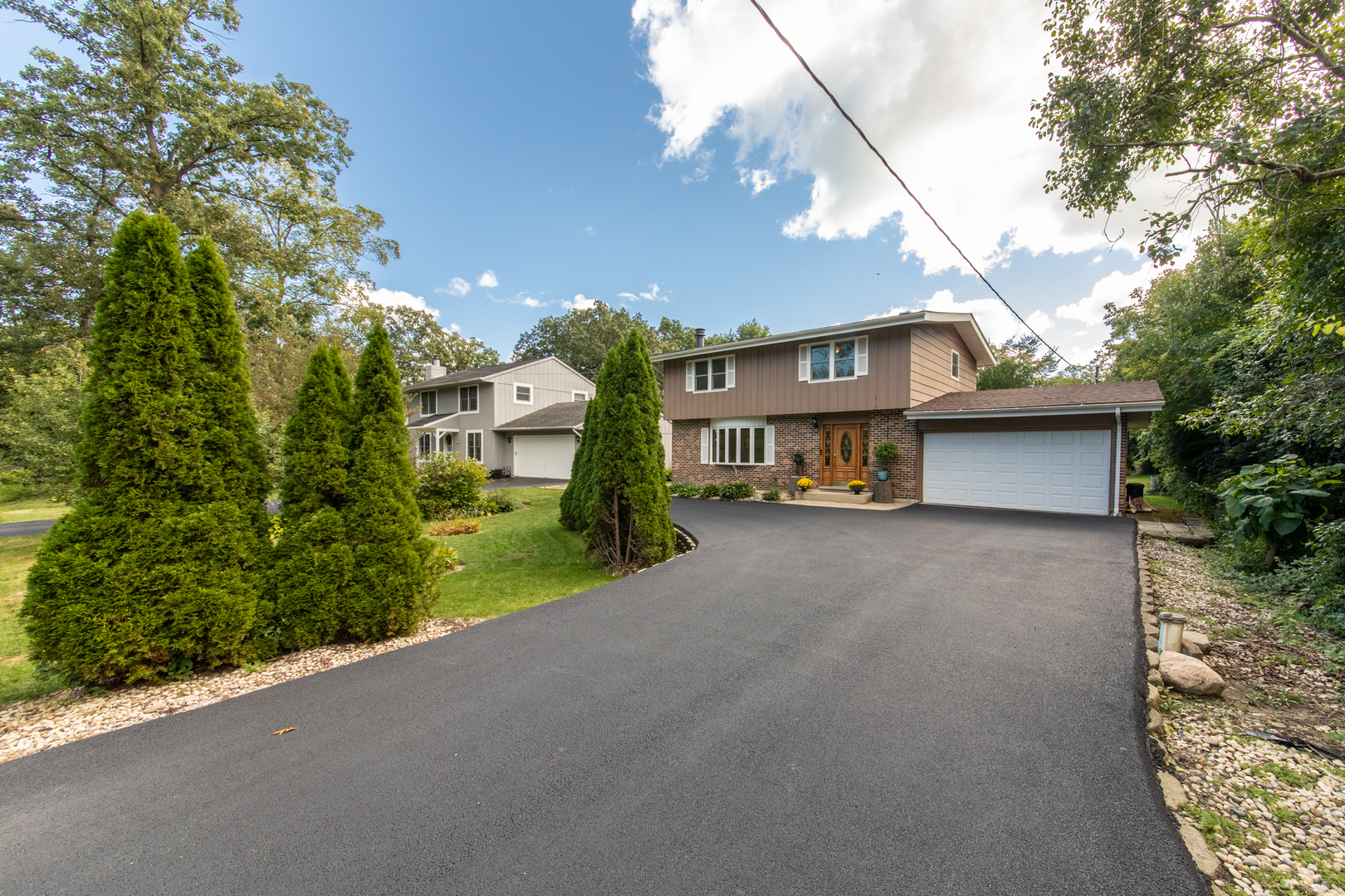 213 Forest View Drive Lake Bluff, IL 60044 - Photo 1 of 37 a view of a house with a yard and garage
