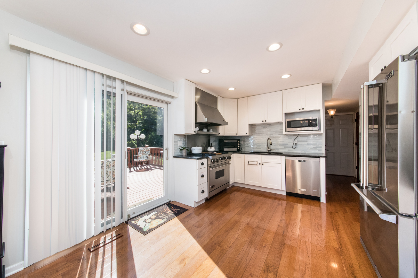 213 Forest View Drive Lake Bluff, IL 60044 - Photo 11 of 37 a kitchen with stainless steel appliances a refrigerator sink and cabinets