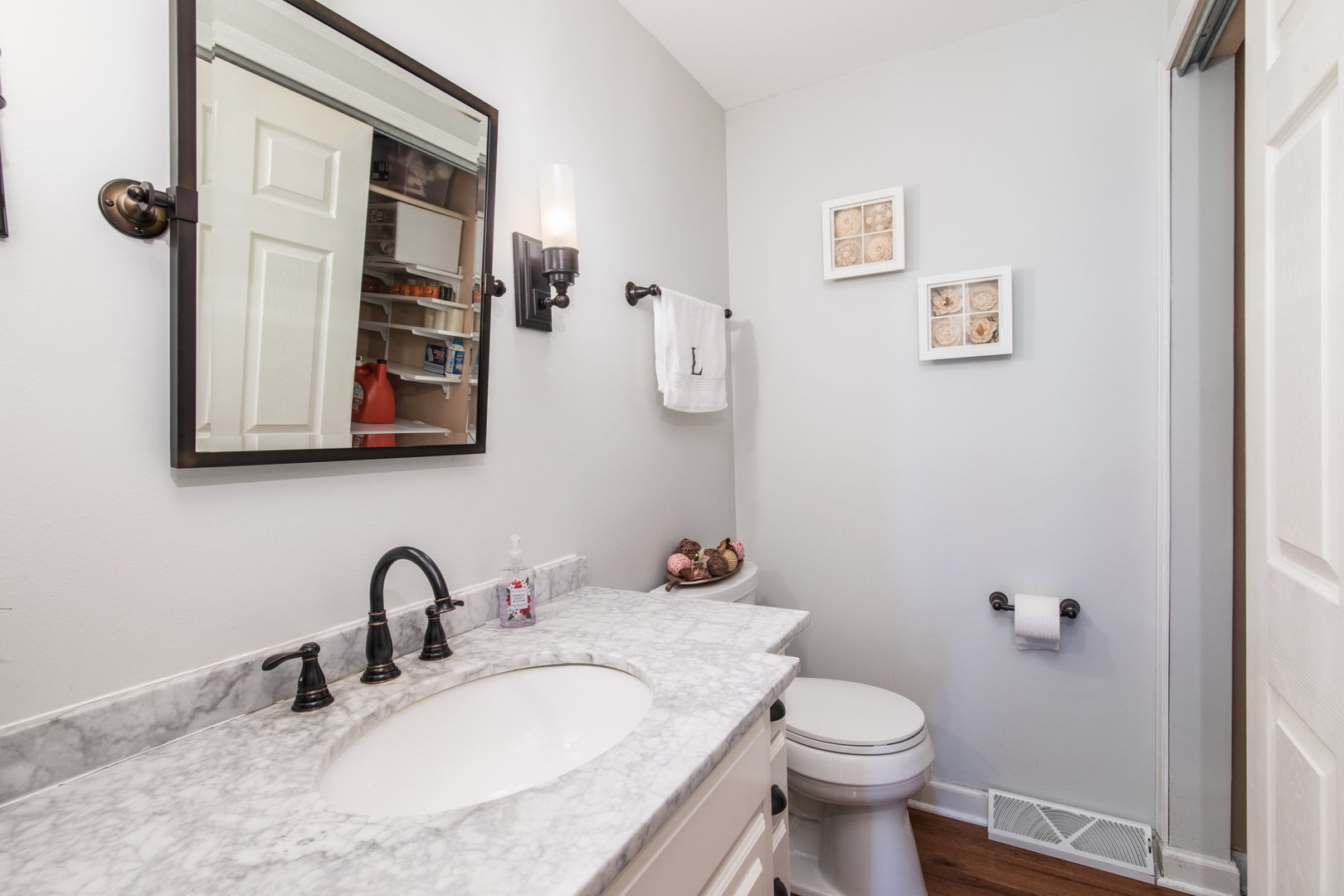 213 Forest View Drive Lake Bluff, IL 60044 - Photo 13 of 37 a bathroom with a granite countertop toilet sink and mirror