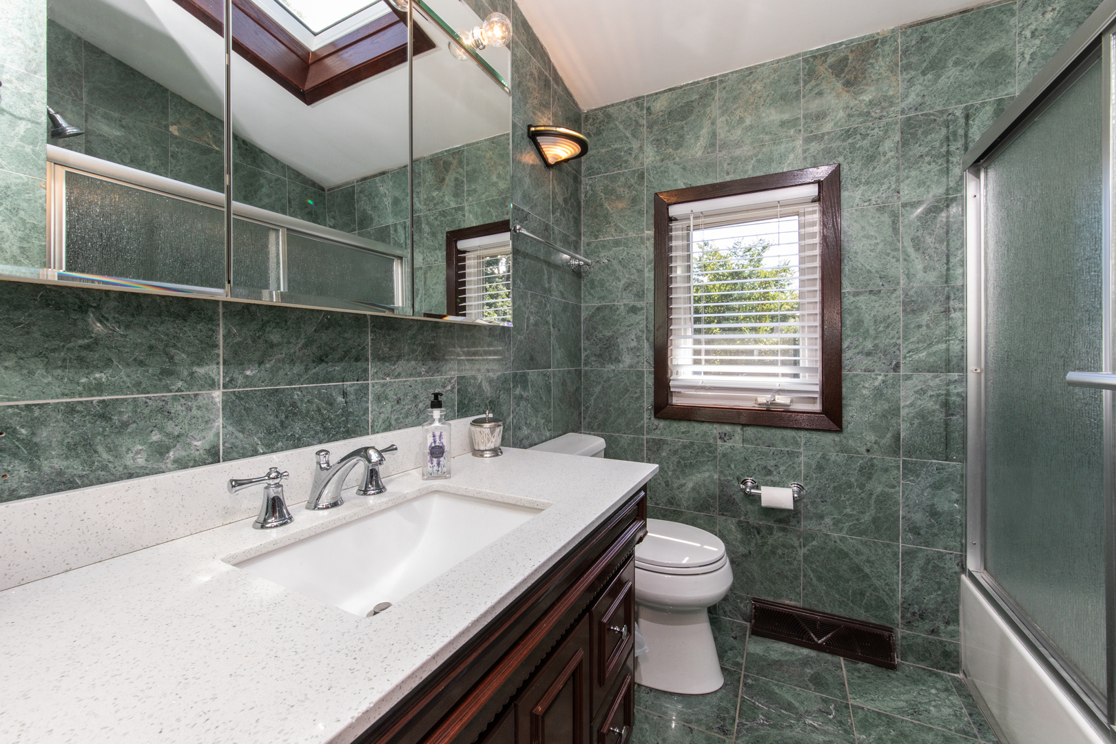 213 Forest View Drive Lake Bluff, IL 60044 - Photo 18 of 37 a bathroom with a sink a toilet and shower