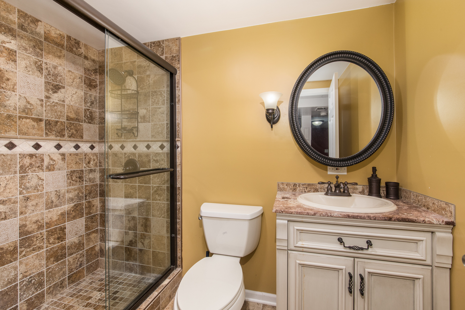 213 Forest View Drive Lake Bluff, IL 60044 - Photo 21 of 37 a bathroom with a granite countertop toilet sink and mirror