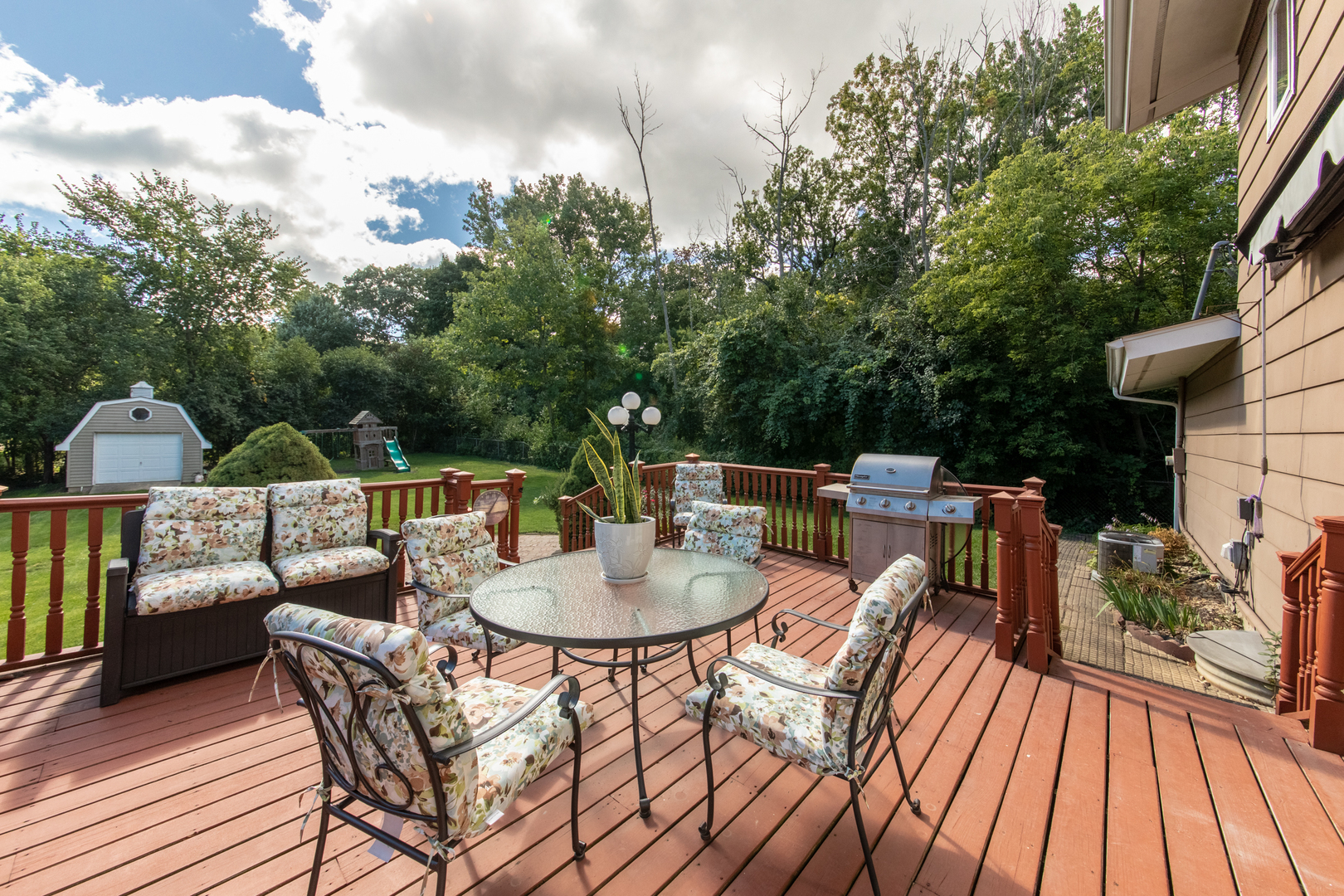213 Forest View Drive Lake Bluff, IL 60044 - Photo 25 of 37 a view of a patio with a dining table and chairs with wooden floor