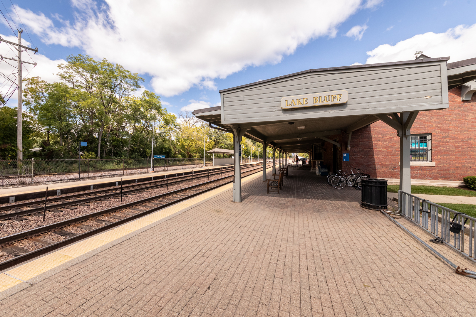 213 Forest View Drive Lake Bluff, IL 60044 - Photo 30 of 37 a view of a patio with table and chairs with wooden floor and fence