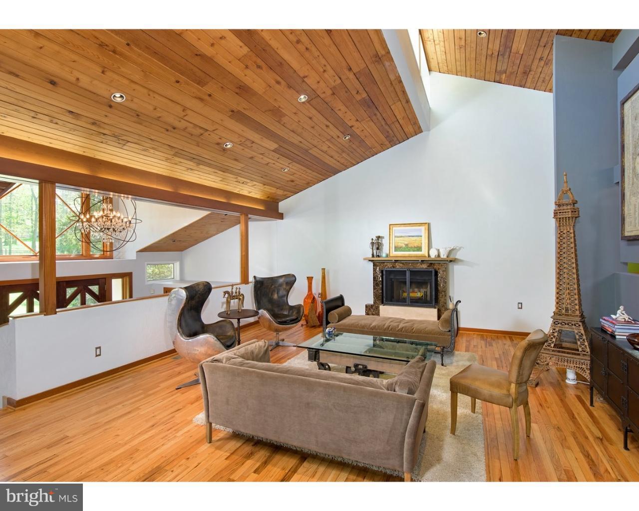 924 Roscommon Road Bryn Mawr, PA 19010 - Photo 9 of 19 Living room .Note Fireplace and wooded ceilings