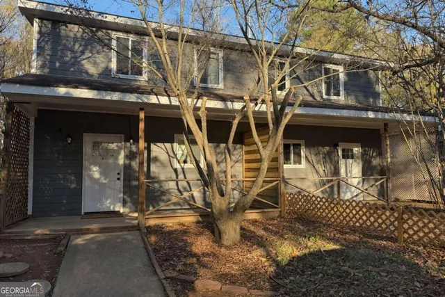 a view of a house with large windows