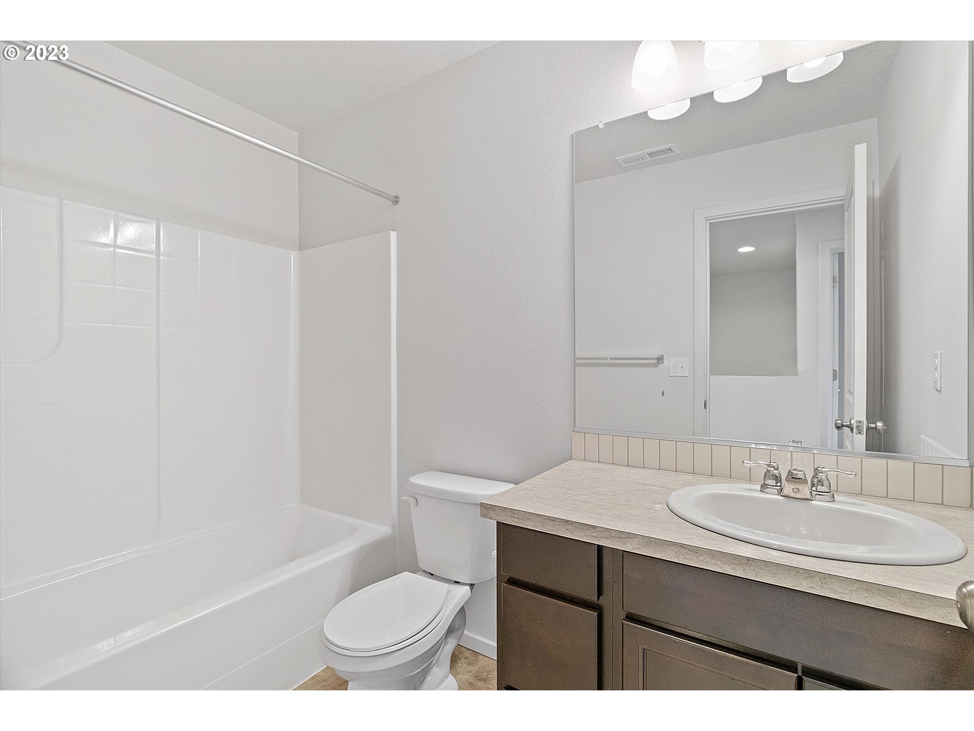 2240 Southeast 16th Street Gresham, OR 97080 - Photo 21 of 36 a bathroom with a sink a toilet and a bathtub