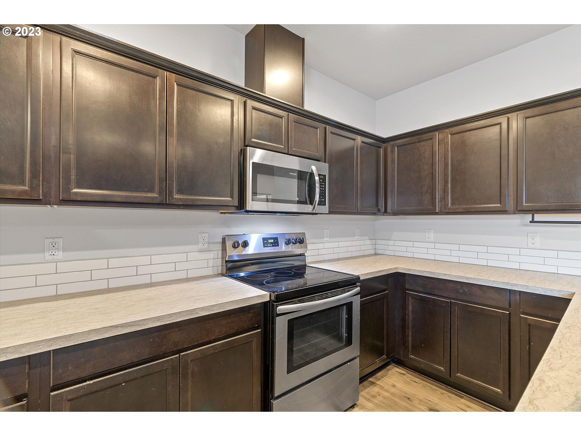 2240 Southeast 16th Street Gresham, OR 97080 - Photo 8 of 36 a kitchen with stainless steel appliances granite countertop a sink stove and microwave