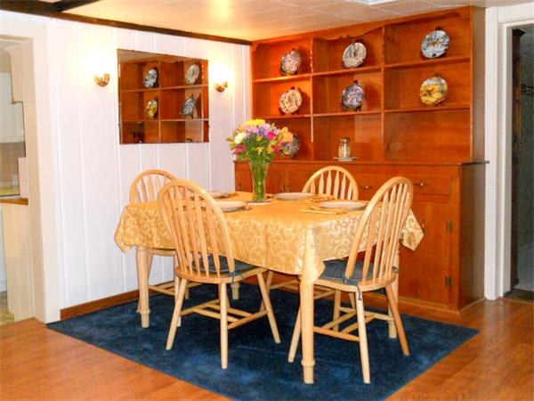 2 Border Road Natick, MA 01760 - Photo 5 of 15 a view of a dining room with furniture and wooden floor