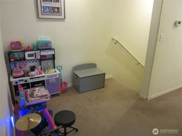 a room with toys and wooden floor