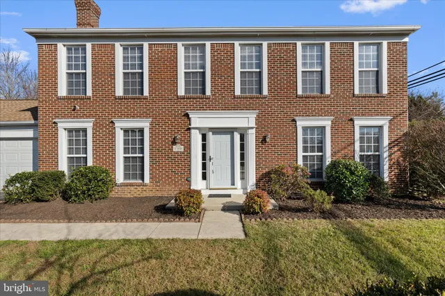 a front view of a house with yard and outdoor seating