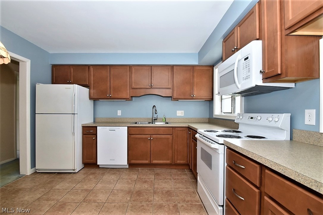 753 Esther Road Cleveland, OH 44143 - Photo 14 of 31 Eat-in kitchen has beautiful cabinets, lots of counter space and ceramic tile floor