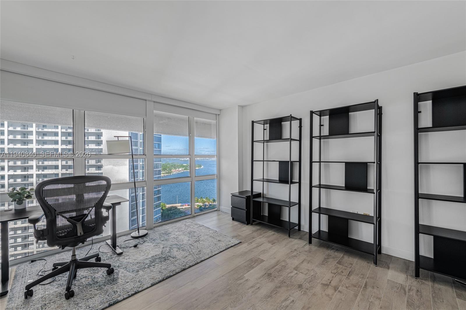 600 Northeast 36th Street, Unit PH1 Miami, FL 33137 - Photo 16 of 41 a view of a workspace with furniture and a window