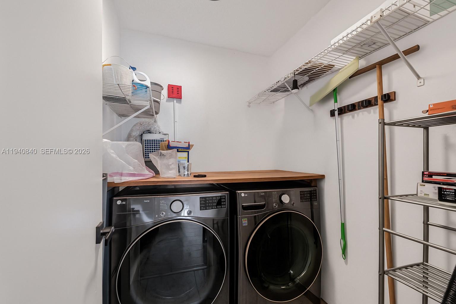 600 Northeast 36th Street, Unit PH1 Miami, FL 33137 - Photo 10 of 41 a utility room with dryer and washer