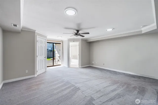 a view of an empty room with a window