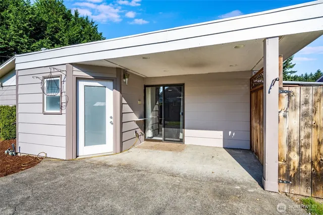 a view of a porch with wooden floor and stairs