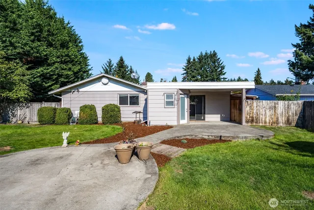 front view of a house with a yard