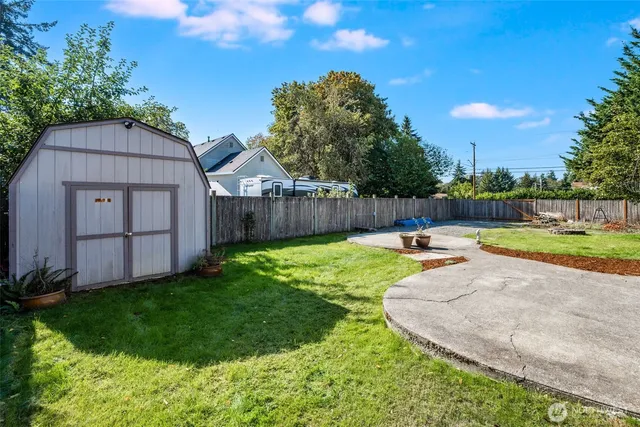 a view of a backyard with a garden and plants