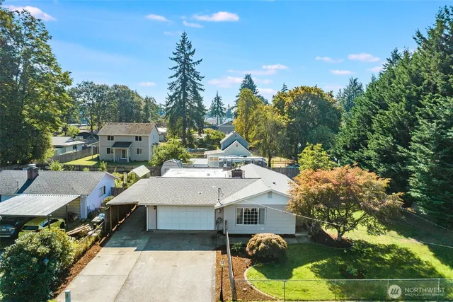 a view of a patio with table and chairs and potted plants
