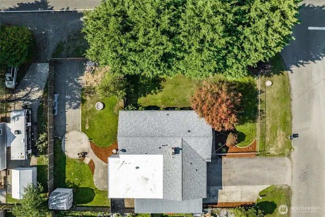 an aerial view of residential houses with outdoor space