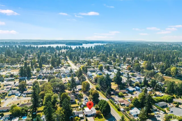 an aerial view of residential houses with city view