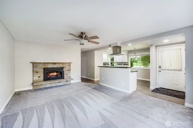 a view of a kitchen and an empty room