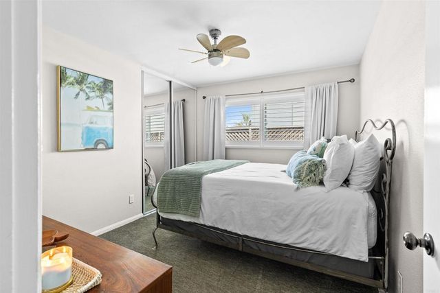 a bedroom with a bed and window