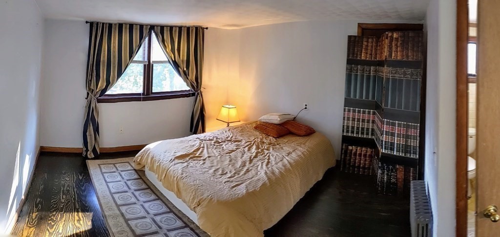 74 Sydney Street, Unit 2 Boston, MA 02125 - Photo 12 of 28 a bedroom with a bed and wooden floor