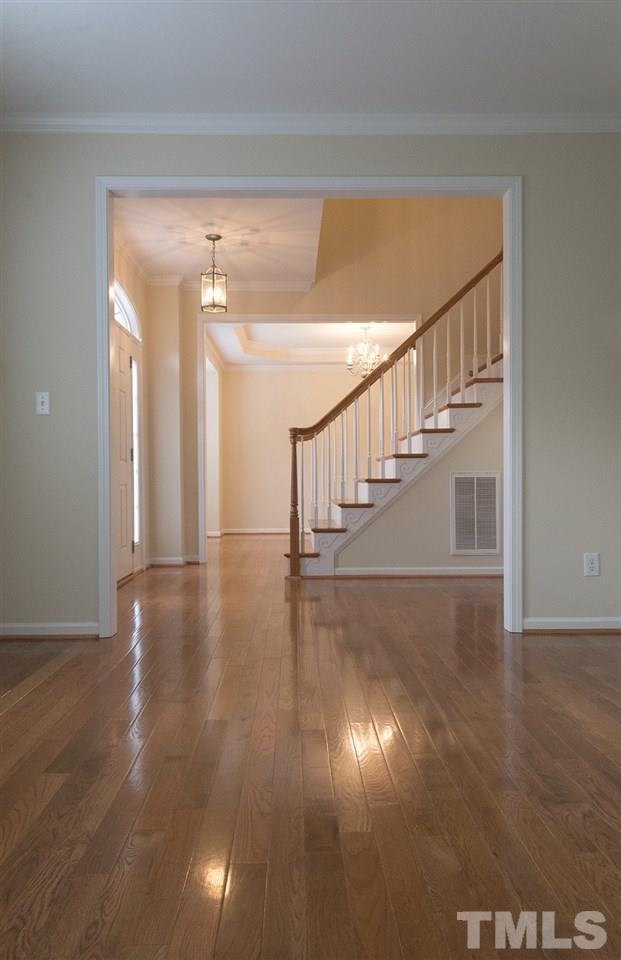 1017 Bianco Drive Raleigh, NC 27607 - Photo 3 of 13 a view of entryway and hall with wooden floor
