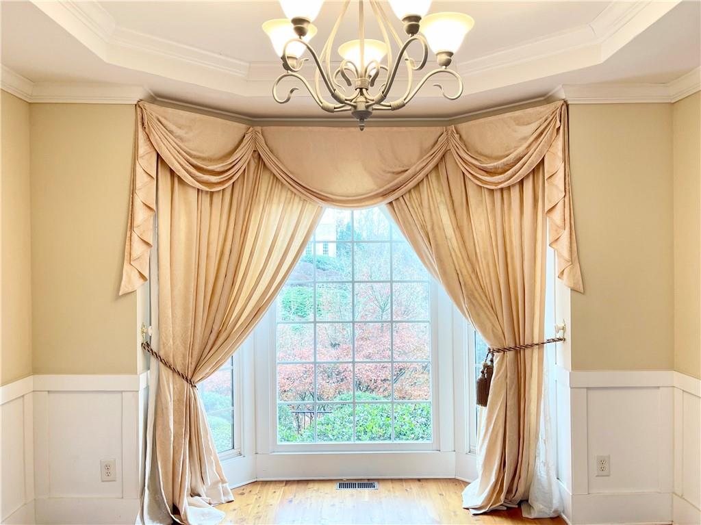 555 Vinings Springs Drive Southeast Mableton, GA 30126 - Photo 13 of 57 a view of a room with wooden floor and windows