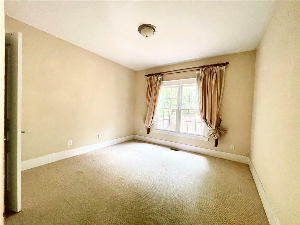 555 Vinings Springs Drive Southeast Mableton, GA 30126 - Photo 24 of 57 a view of an empty room with a window